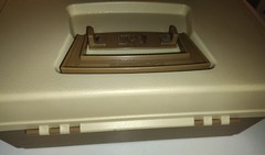 vintage Plano 5000 two-tier tackle box in a tan and brown color scheme.