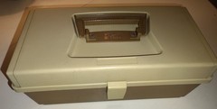 vintage Plano 5000 two-tier tackle box in a tan and brown color scheme.